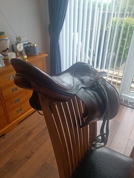 Brown leather saddle in good condition