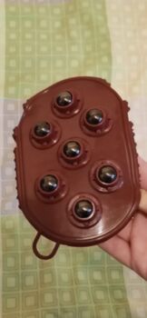 Massagestriegel mit Rollern und Noppen