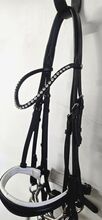 Full size HKM double bridle complete with 5.5" bits and reins. HKM